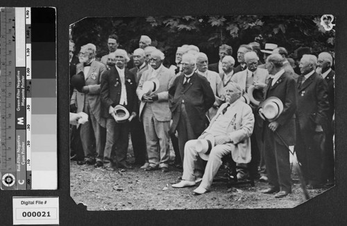 Harrison Gray Otis seated outdoors with group of men