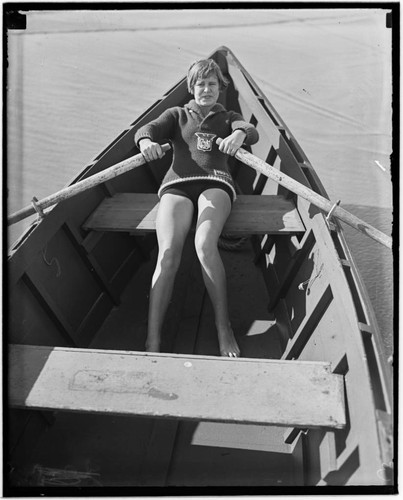 Lily May Bowmer rowing a boat at the beach, Santa Monica, California