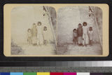 A group of Pueblo Indian children standing against a wall