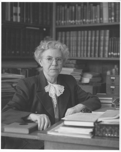 Elizabeth Connor, seated at her desk, Mount Wilson Observatory Library, Pasadena