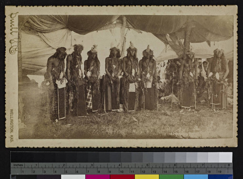 An Arapahoe fraternity in dancing dress. Fort Reno, 1886