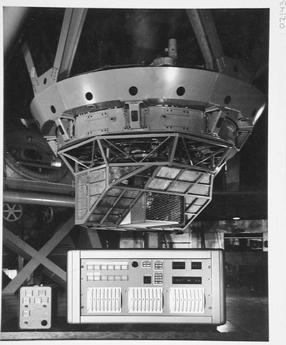 Read-in control and system control boxes on a table in front of the 200-inch telescope, Palomar Observatory