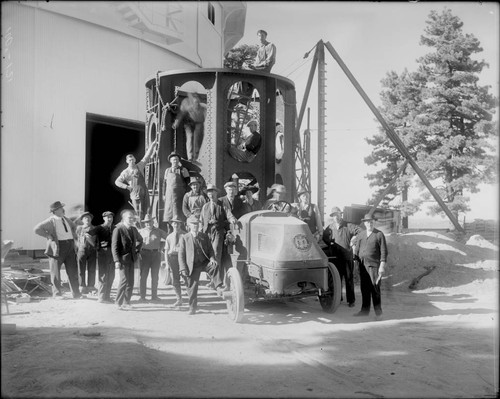 A crowd surrounding the lower section of the 100-inch telescope tube, Mount Wilson Observatory