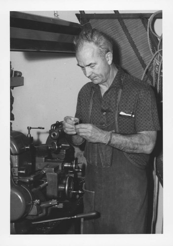 Melvin Johnson working inside Mount Wilson Observatory's machine shop, Pasadena