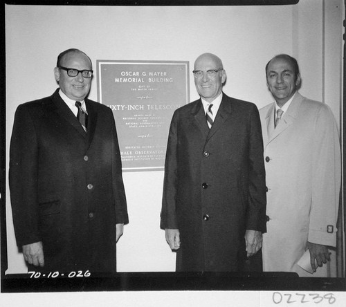 The three Mayer brothers with the dedication plaque of the Oscar G. Meyer memorial building, Palomar Observatory