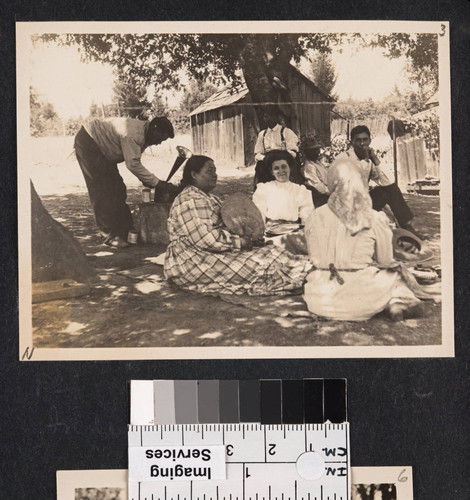 William Benson with phonograph, at left. Mary Knight Benson seated with fan, and Grace Nicholson facing camera, center