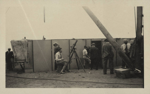 Edwin Powell Hubble seated at a small telescope, Point Loma