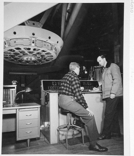 Jim Miller and Bill Baum at the 200-inch telescope control desk, Palomar Observatory
