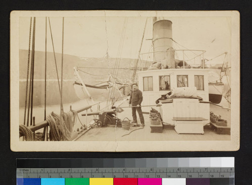 Gunner and equipment on deck of unidentified ship