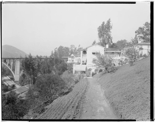 Bungalow at Vista Del Arroyo Hotel with bridge in background, 125 South Grand, Pasadena. 1924