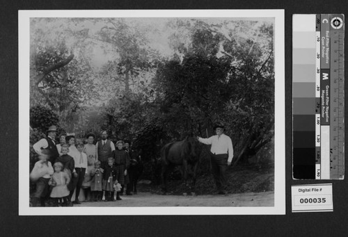 Harrison Gray Otis and family outdoors with horse