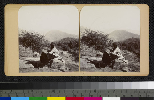 Mono woman holding a winnowing basket, Owens Valley, California