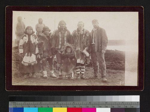 Alaska natives, possibly a family, with two Caucasian men