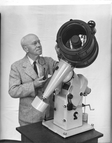 Russel W. Porter beside an 8-inch f/1.0 Schmidt telescope of his design