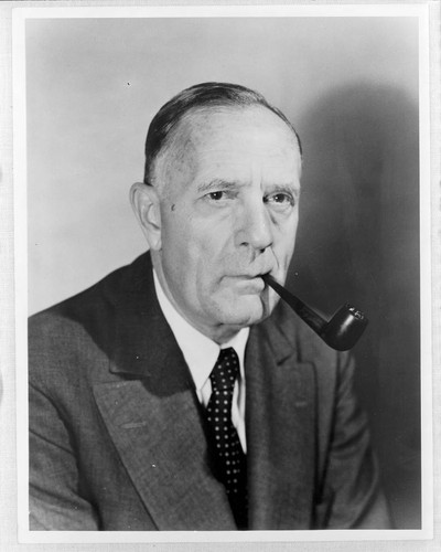 Edwin Powell Hubble, with a pipe