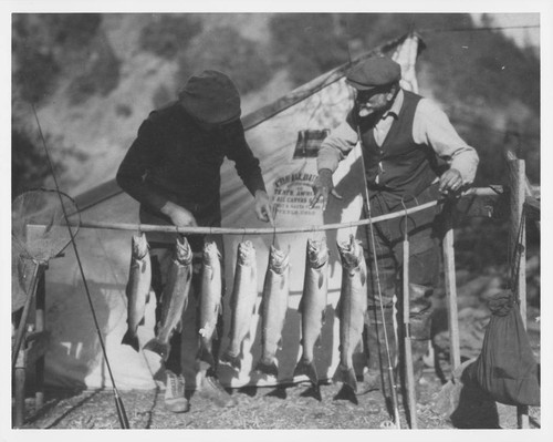 Ferdinand Ellerman and an unidentified companion, with caught fish