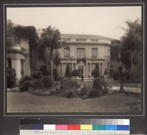 Henry E. Huntington standing near fountain on north side of residence, circa 1915