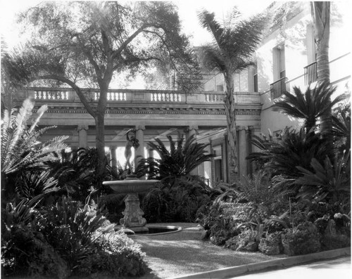 Rockery with fountain and cycads near the Huntington residence