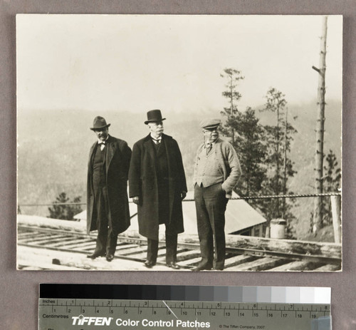 Henry E. Huntington and two other men on railroad tracks, April 7 1914