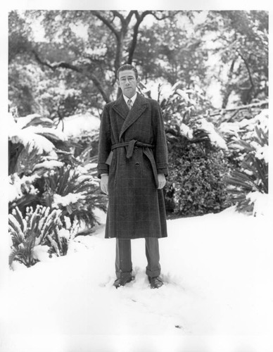 Frank Rinehart on the grounds after snowfall, January 11, 1949