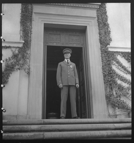 Guard at entrance to library building