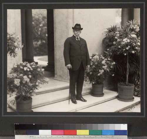 Portrait of Henry E. Huntington on loggia steps, circa 1920