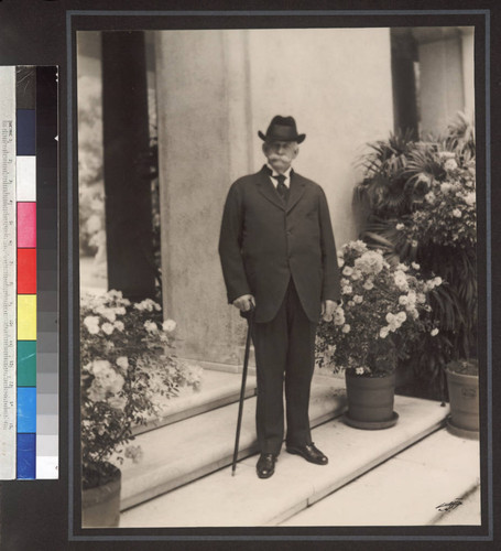 Portrait of Henry E. Huntington on loggia steps, circa 1920