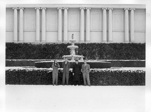 Huntington employees in front of the library building after snowfall, January 11, 1949