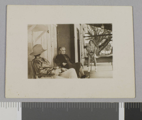 Older woman and two others on porch