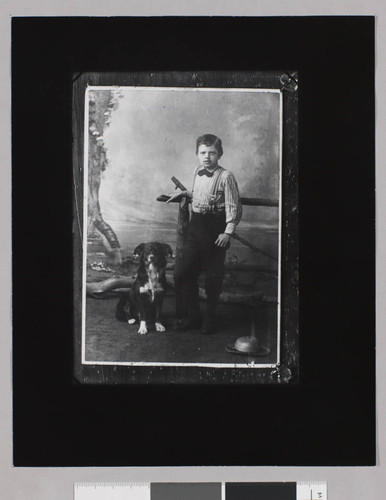 Young Jack London with dog