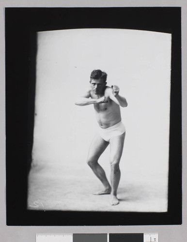 Jack London, seminude in fighting stance