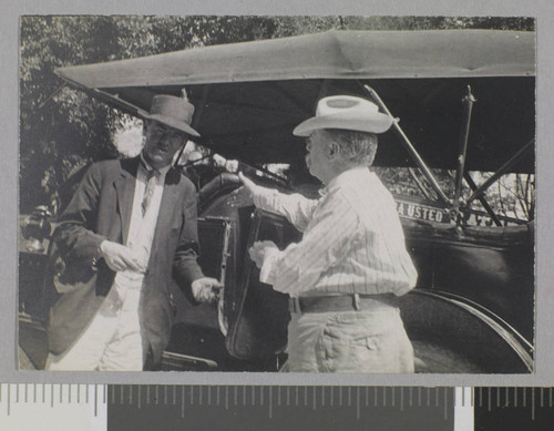 Two men and automobile