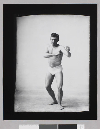 Jack London, seminude in fighting stance