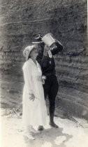 Soldier with water bucket on beach