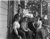 Group portrait on porch of house, circa 1912