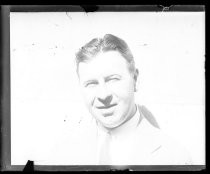 Clean-shaven man, posing outdoors