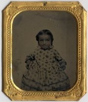 Portrait of young girl in calico dress