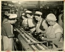 Women preparing pears for canning