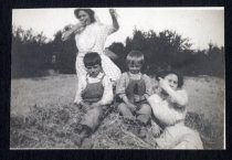 Hansen boys sitting in hay