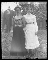 Two women posing in yard