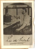 Lee de Forest seated at desk with wireless telegraph device "Smoke Tree Ranch"