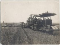 Portrait of six farm workers on a tractor