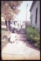 Laying brick walkway outside doctor's office