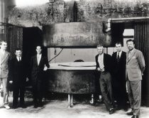 Ernest O. Lawrence and colleagues with large magnet, cyclotron