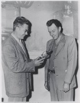 Jack A. McCullough and William W. Eitel, with a power transmitting tube