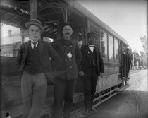 Trolley car engineers, conductor, and trolley