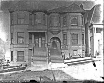 Victorian apartment buildings on a city hill, c. 1912