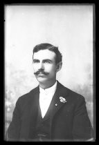 Portrait of man with carnation in lapel