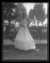 Woman in white Fiesta de las Rosas dress