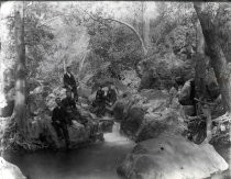 Group portrait next to a stream